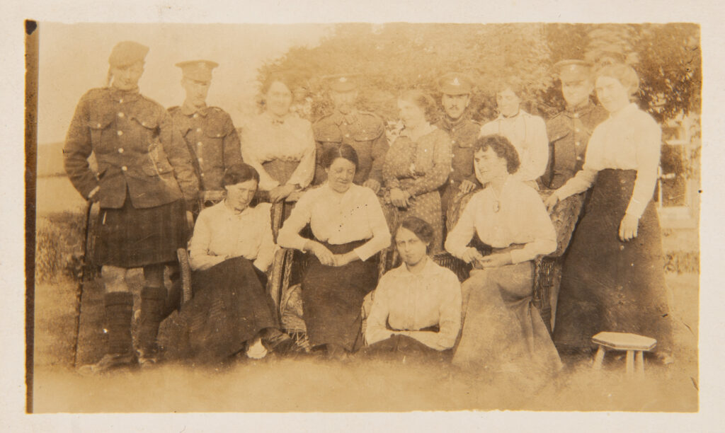 Group of ladies with WW1 Soldiers