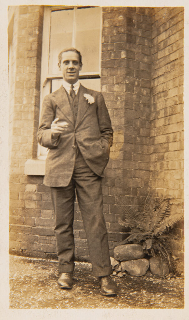 Wedding Guest standing outside house