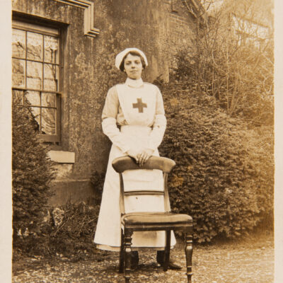 Nurse standing by chair outside