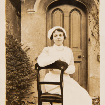 Nurse sitting on a chair outside