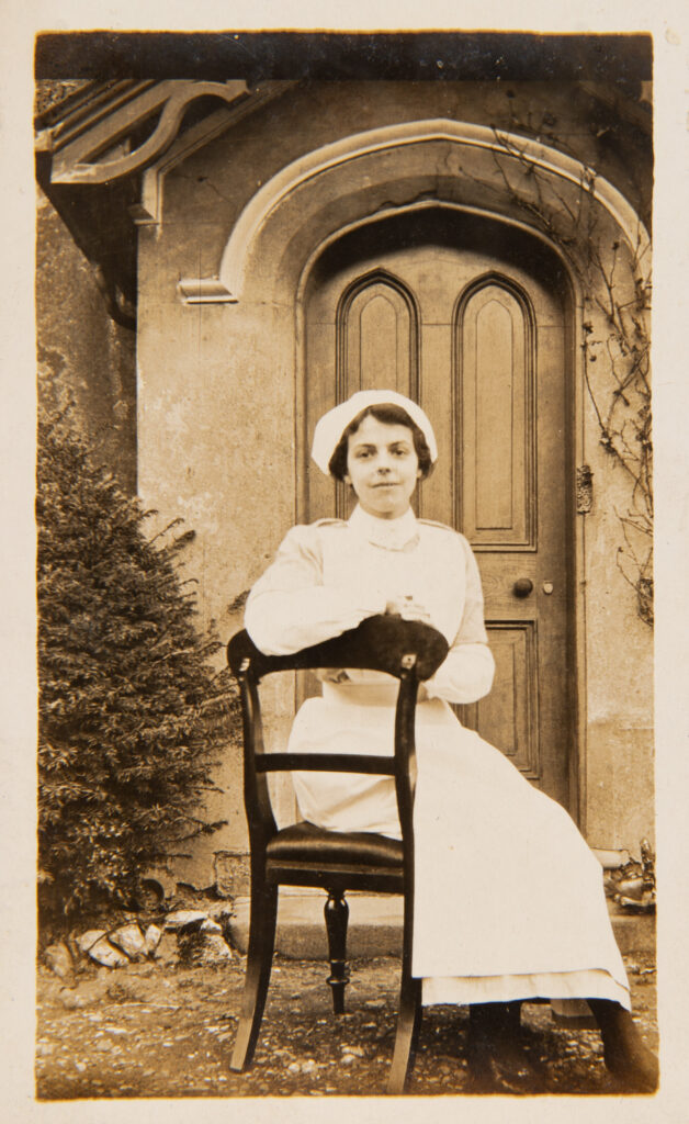 Nurse sitting on a chair outside