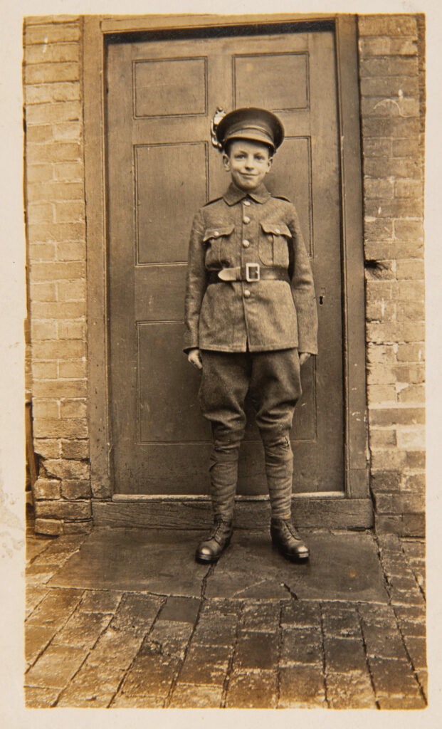 Boy Soldier standing in doorway