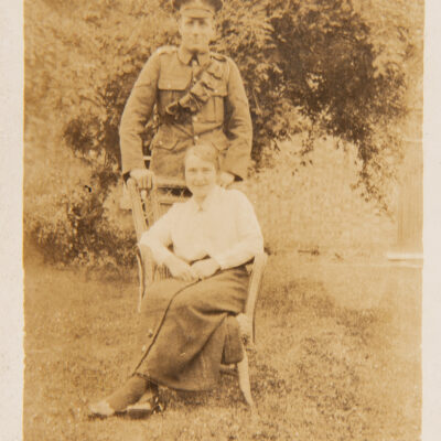 Soldier with Lady sitting on Chair