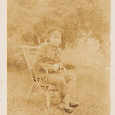 WW1 Soldier sitting on chair outside