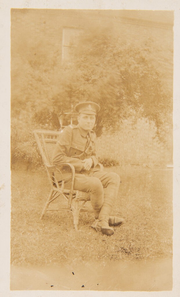 WW1 Soldier sitting on chair outside