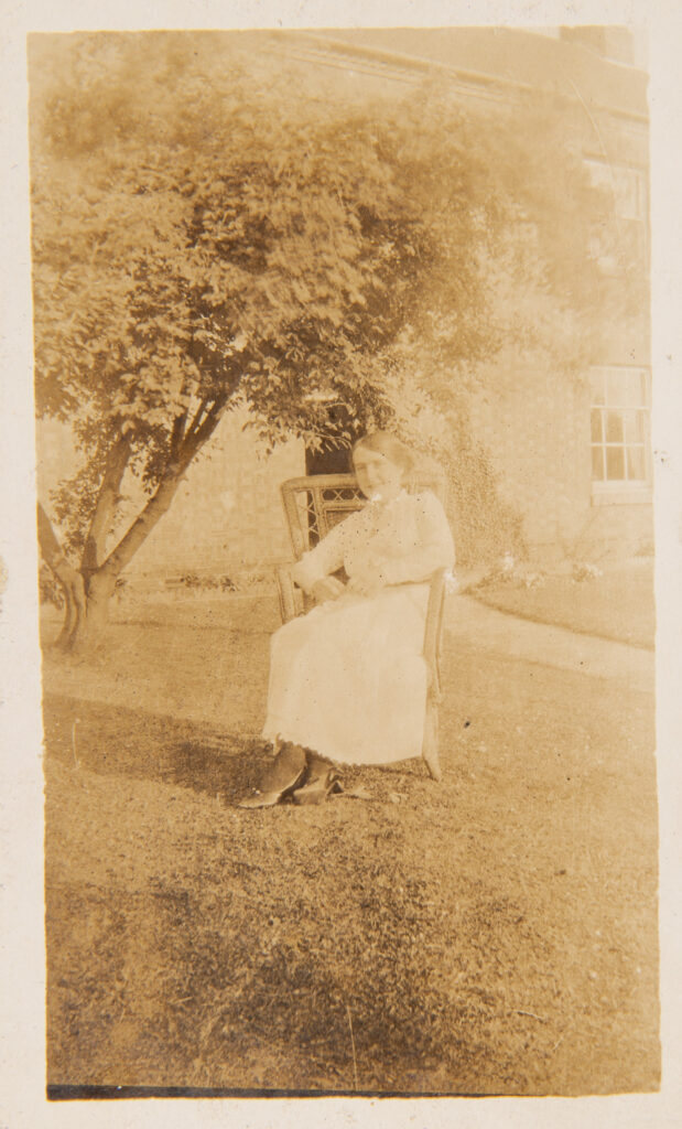 Lady sitting on chair outside