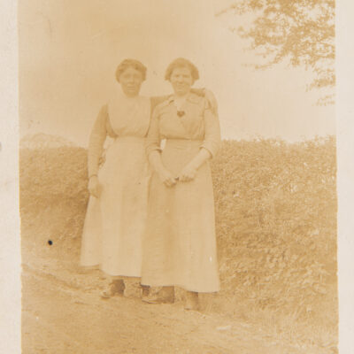 Two ladies standing on farm track