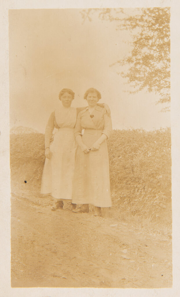 Two ladies standing on farm track