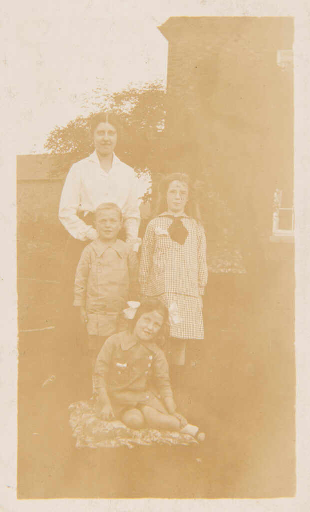 Mother with children in the garden