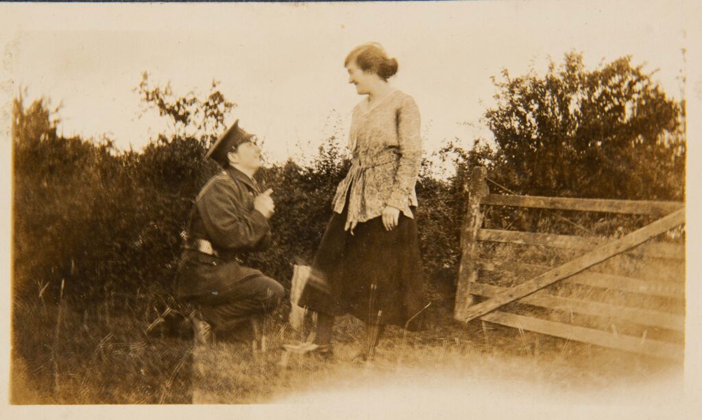 Soldier kneeling in front of girl
