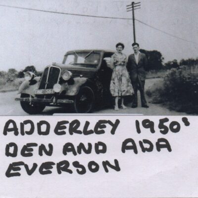 Dan and Ada Everson standing by a Car