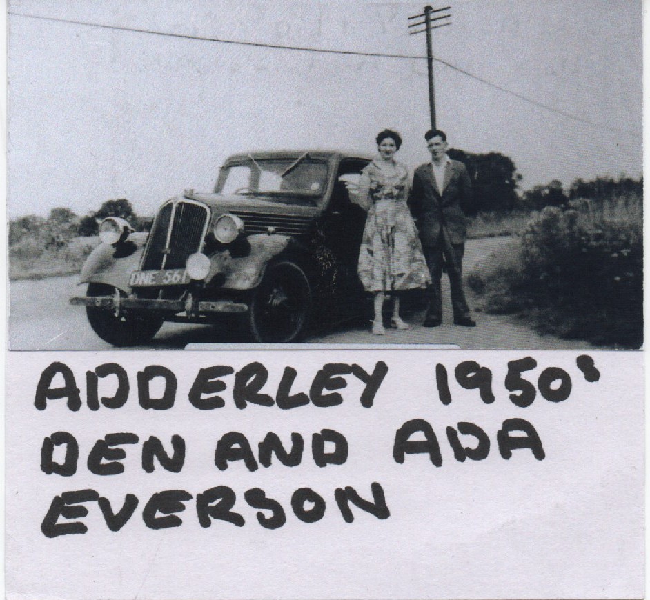 Dan and Ada Everson standing by a Car