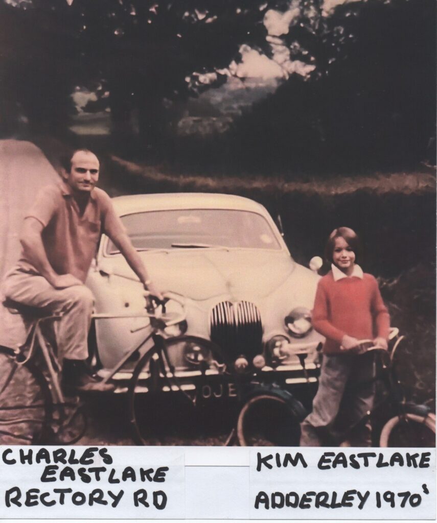 Charles and Kim East Lake with Bikes in front of Jaguar Car